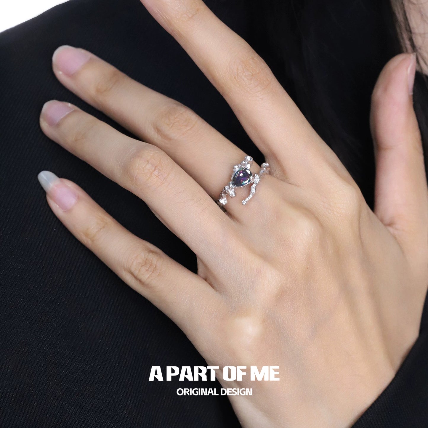 Amethyst silver vine ring featuring elegant design with sparkling accents on a model's hand