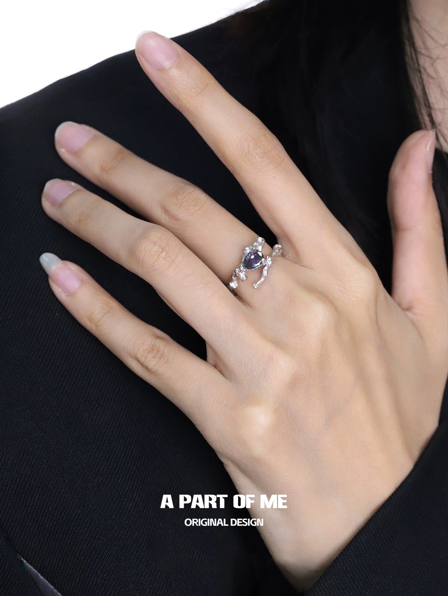A PART OF ME amethyst silver vine ring displayed on a hand, showcasing its elegant design