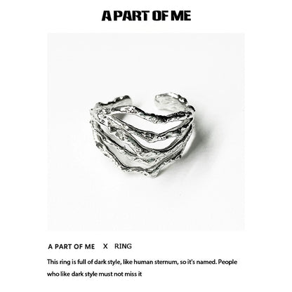 Bone minimalist ring from A PART OF ME featuring a dark, textured design resembling human sternum