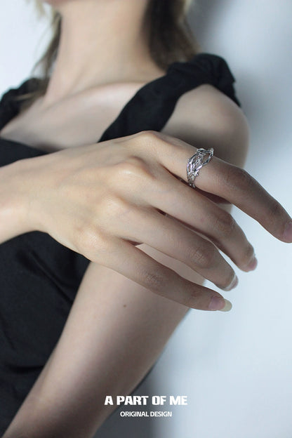 Elegant irregular silver ring showcased on a hand, designed by A PART OF ME