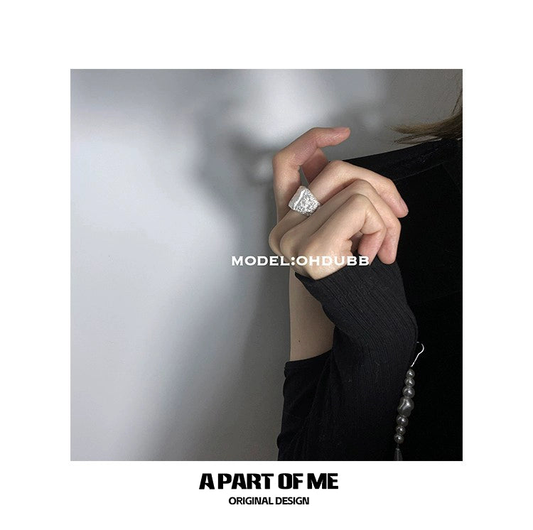 Fashionable silver foil textured ring worn on a model's finger for an elegant look