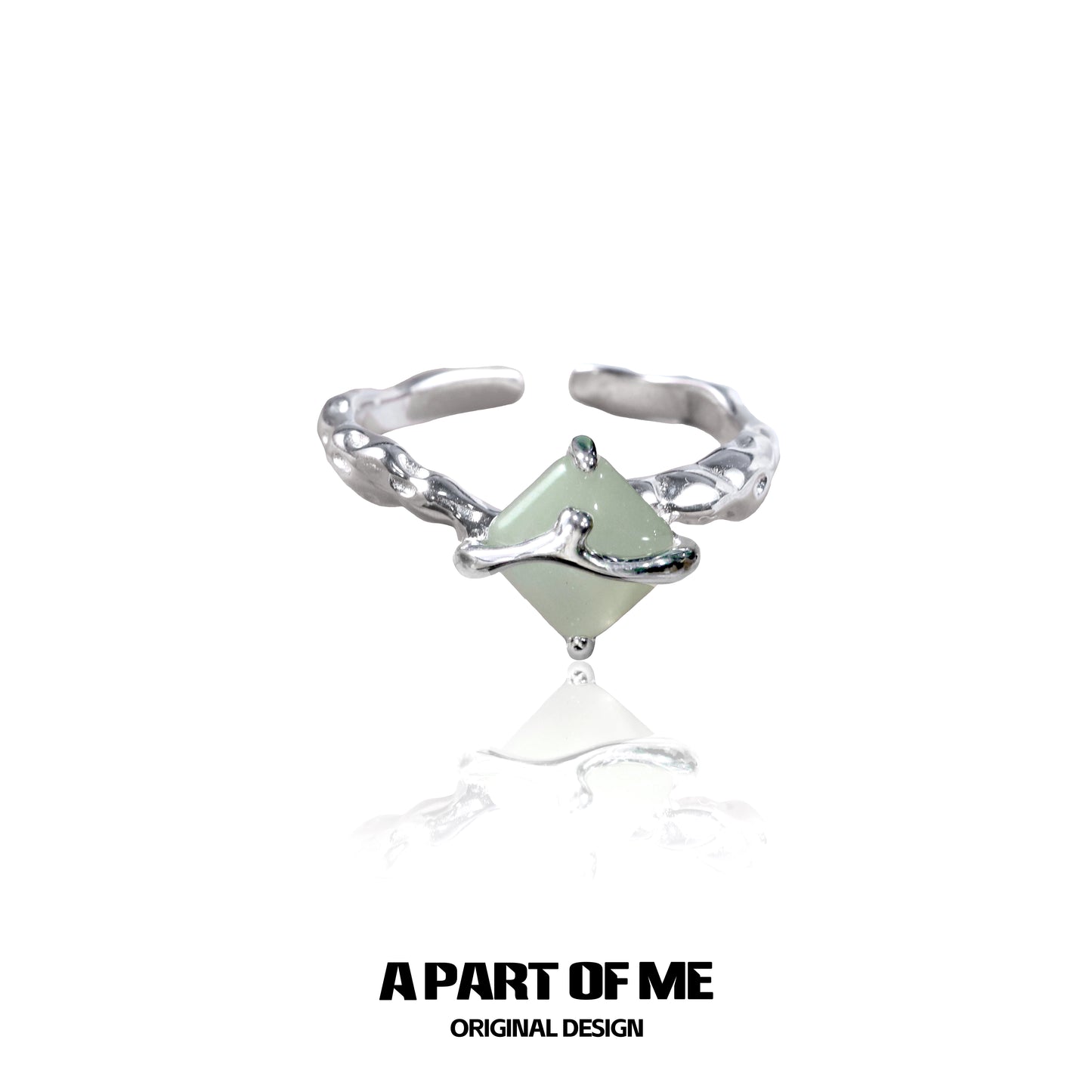 Unique silver gothic ring featuring a green gemstone in an intricate design from A PART OF ME