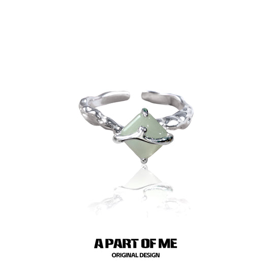 Unique silver gothic ring featuring a green gemstone in an intricate design from A PART OF ME