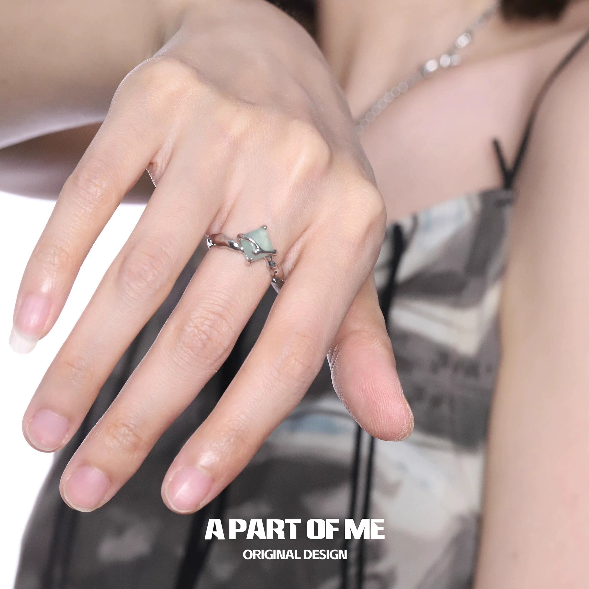 A unique silver gothic ring displayed on a hand showcasing its intricate design and craftsmanship