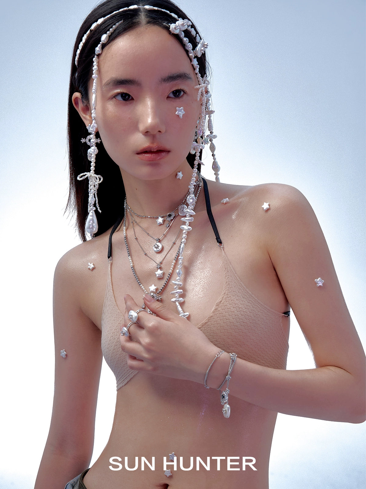 Elegant pearl bracelet for women showcased on model with layered accessories and delicate styling