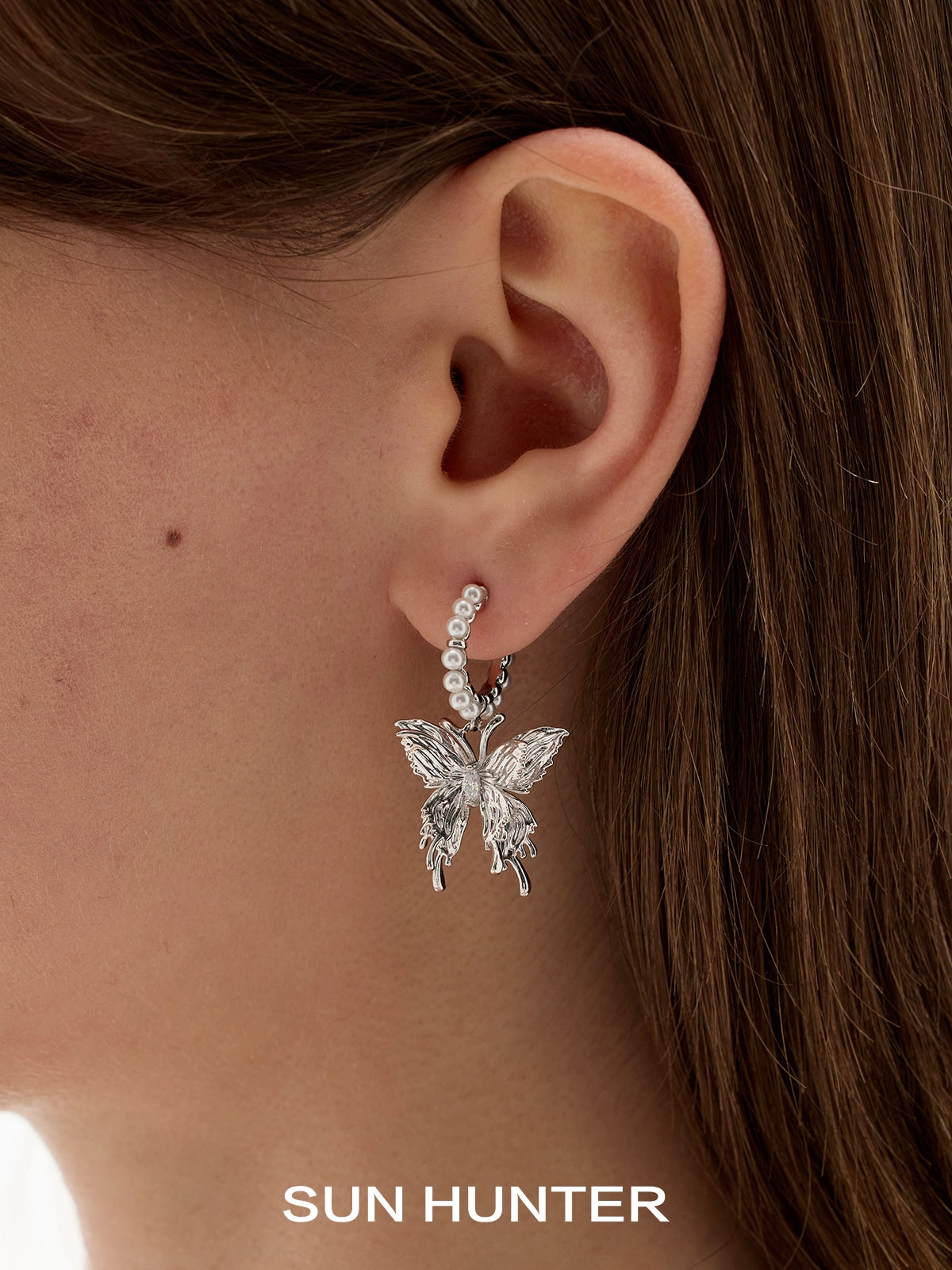 Silver pearl butterfly earrings featuring elegant design and classic charm for stylish accessorizing