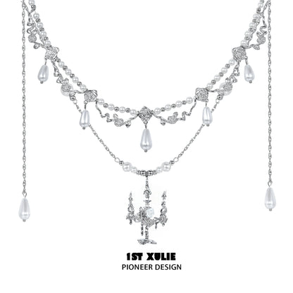 Elegant 1STXULIE pearl clavicle necklace featuring intricate silver designs and dangling pearls