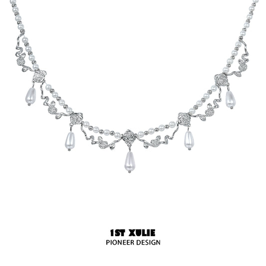 Elegant silver pearl clavicle necklace with intricate leaf design and dangling pearls