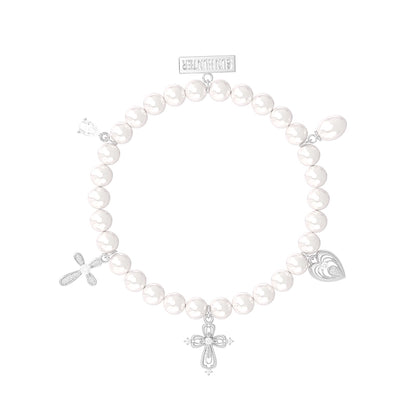 Elegant pearl cross bracelet featuring silver charms for a stylish accessory look