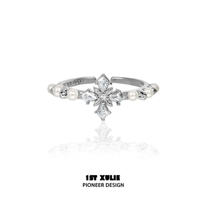 Elegant pearl cross silver ring featuring a unique design with sparkling details