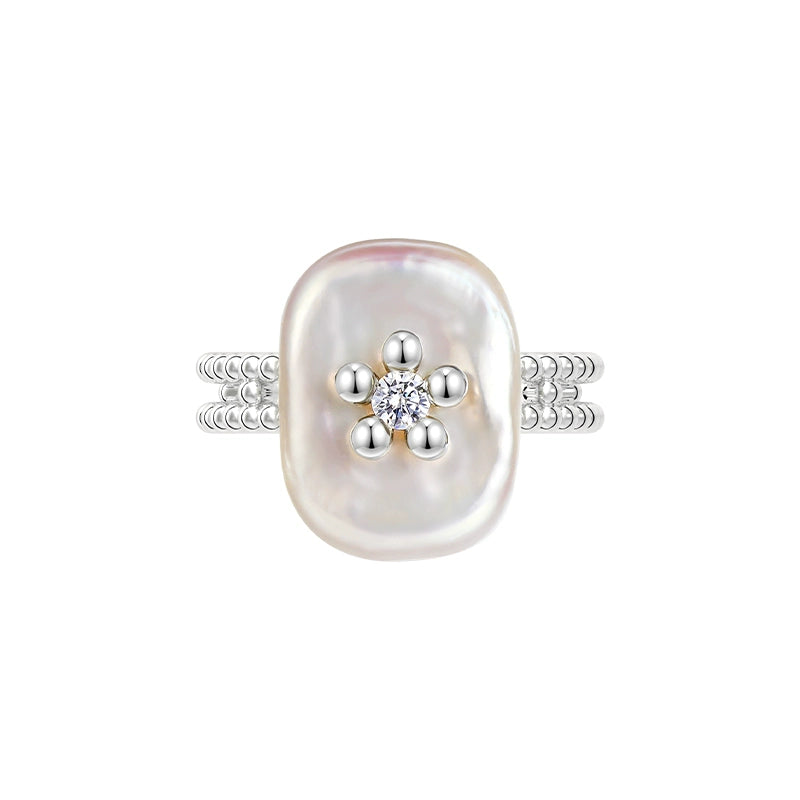 SUN HUNTER Pearl Riddle Rings with a unique oval pearl and sparkling diamond accents