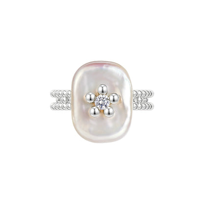 SUN HUNTER Pearl Riddle Rings with a unique oval pearl and sparkling diamond accents
