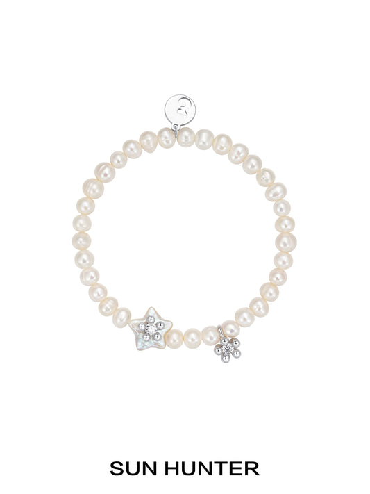 SUN HUNTER pearl star bracelet with natural pearls and star charms for elegant jewelry styling