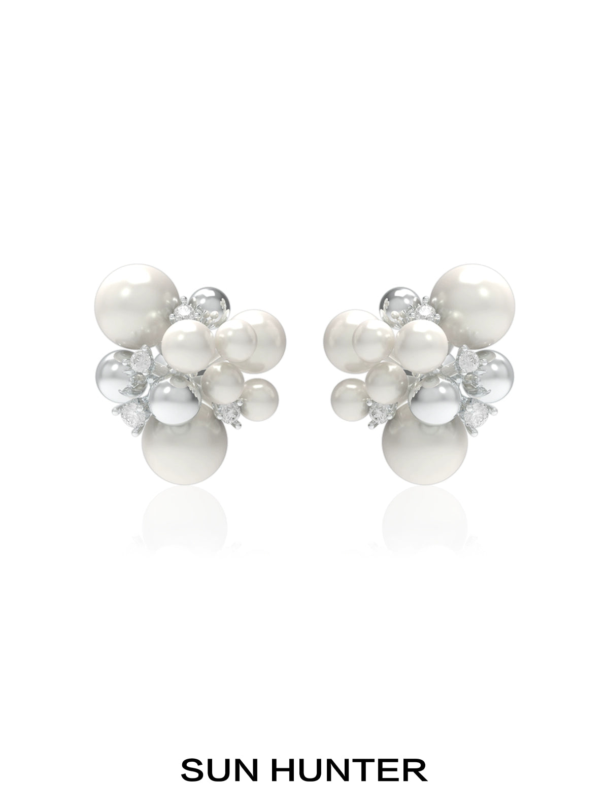 SUN HUNTER pearl zircon statement earrings featuring a cluster design with lustrous pearls and sparkling zircon.