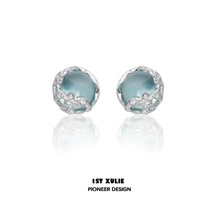 Stylish aqua gemstone stud earrings with a unique silver setting for elegant looks