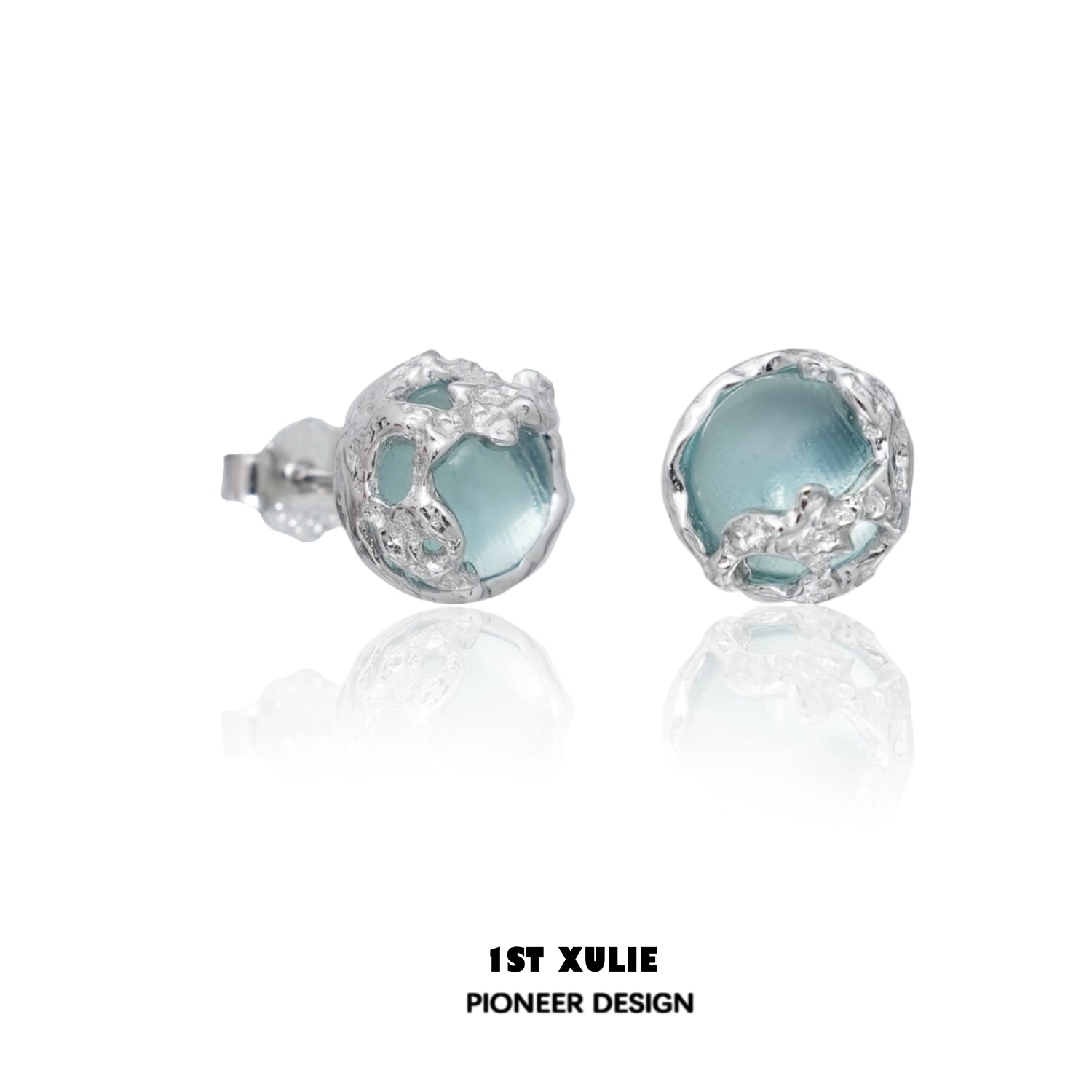 Elegant aqua gemstone stud earrings in a unique silver design perfect for any occasion