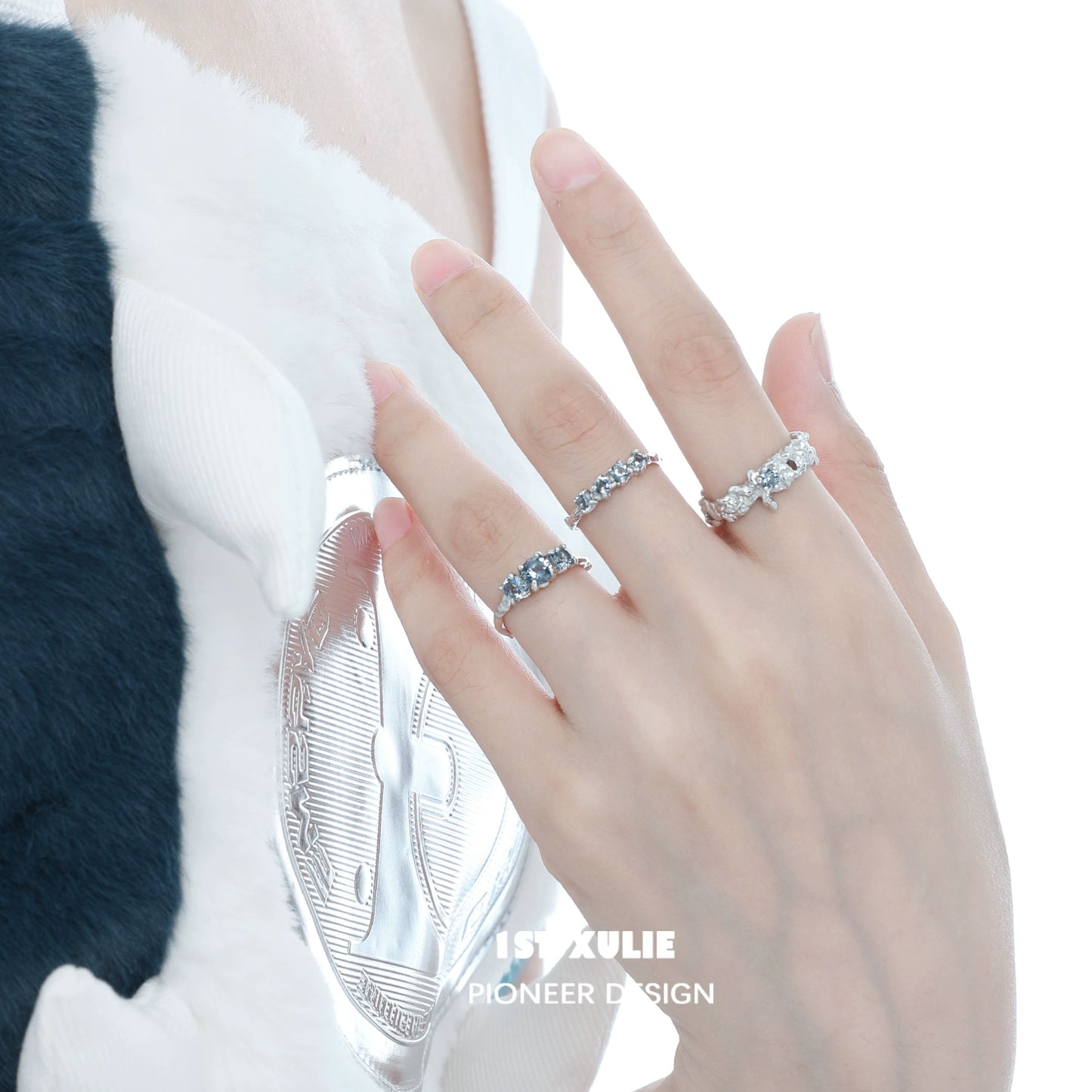 Elegant 1STXULIE Aurora Glacier Silver Ring displayed on a model's hand, showcasing its stunning design