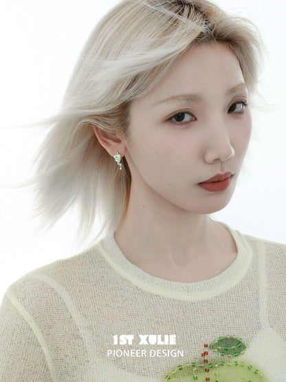 Beautiful woman wearing forbidden apple snake ear clip showcasing a unique and trendy design