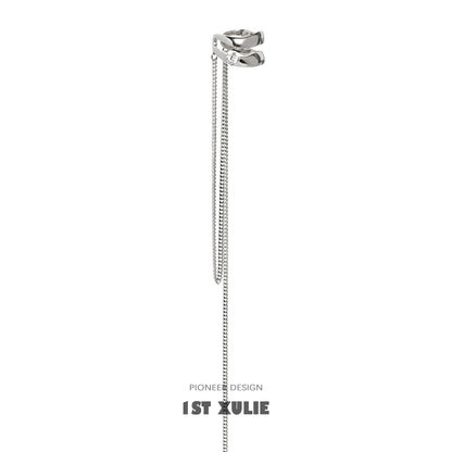 Sleek silver punk tassel ear cuff with chain detailing for a bold fashion statement