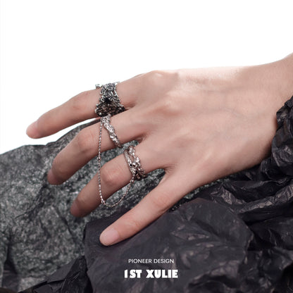 Stylish hand wearing a Y2K controller chain silver ring, perfect for trendy accessories.