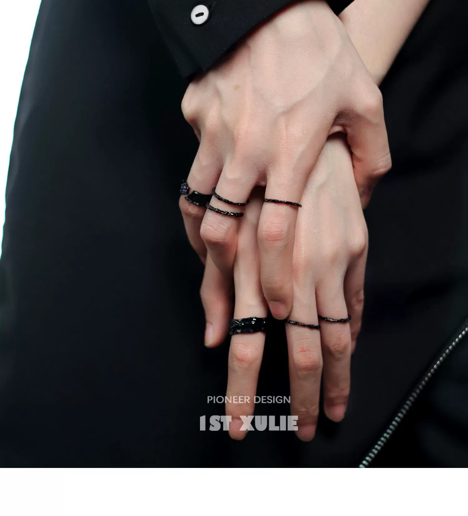 Black Y2K gothic couple rings worn on hands, showcasing stylish and edgy design elements