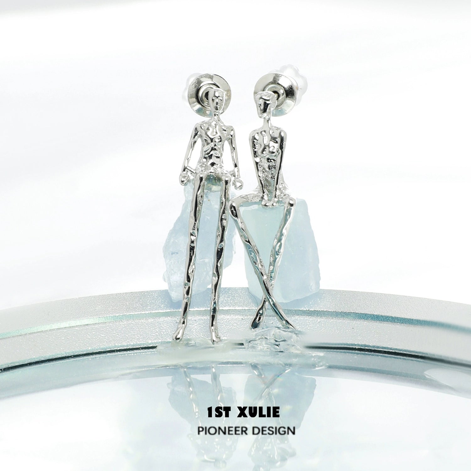 Y2K modern muse stud earrings in silver with unique human figure design for a trendy look