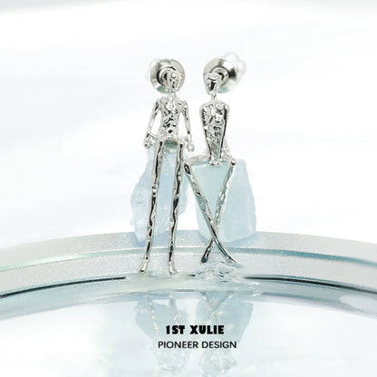 Y2K modern muse stud earrings in silver with unique human figure design for a trendy look