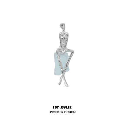 Y2K modern muse stud earrings featuring a unique design with silver-tone and aquamarine accents