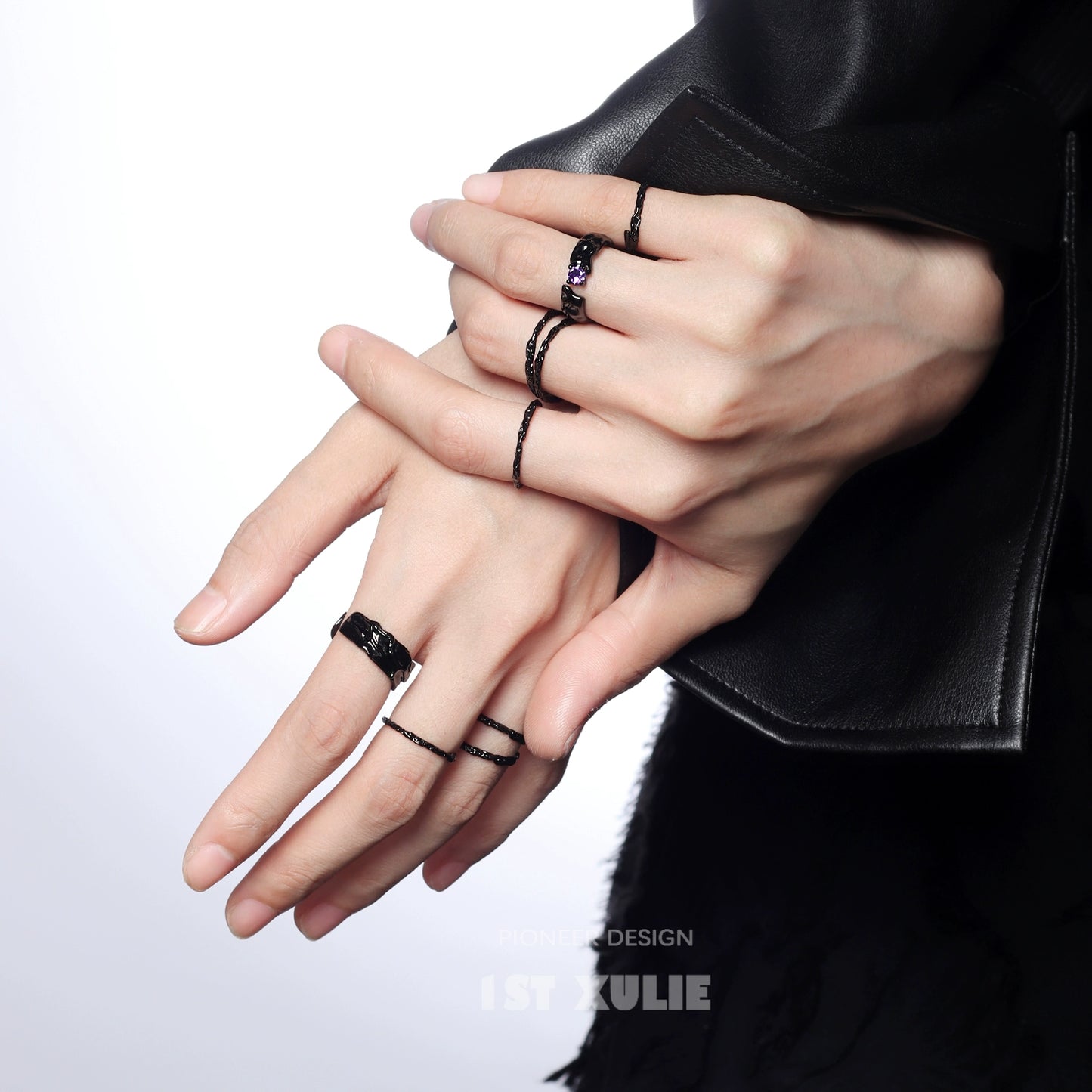 Y2K silver ring collection displayed on model's hands with stylish minimalist design
