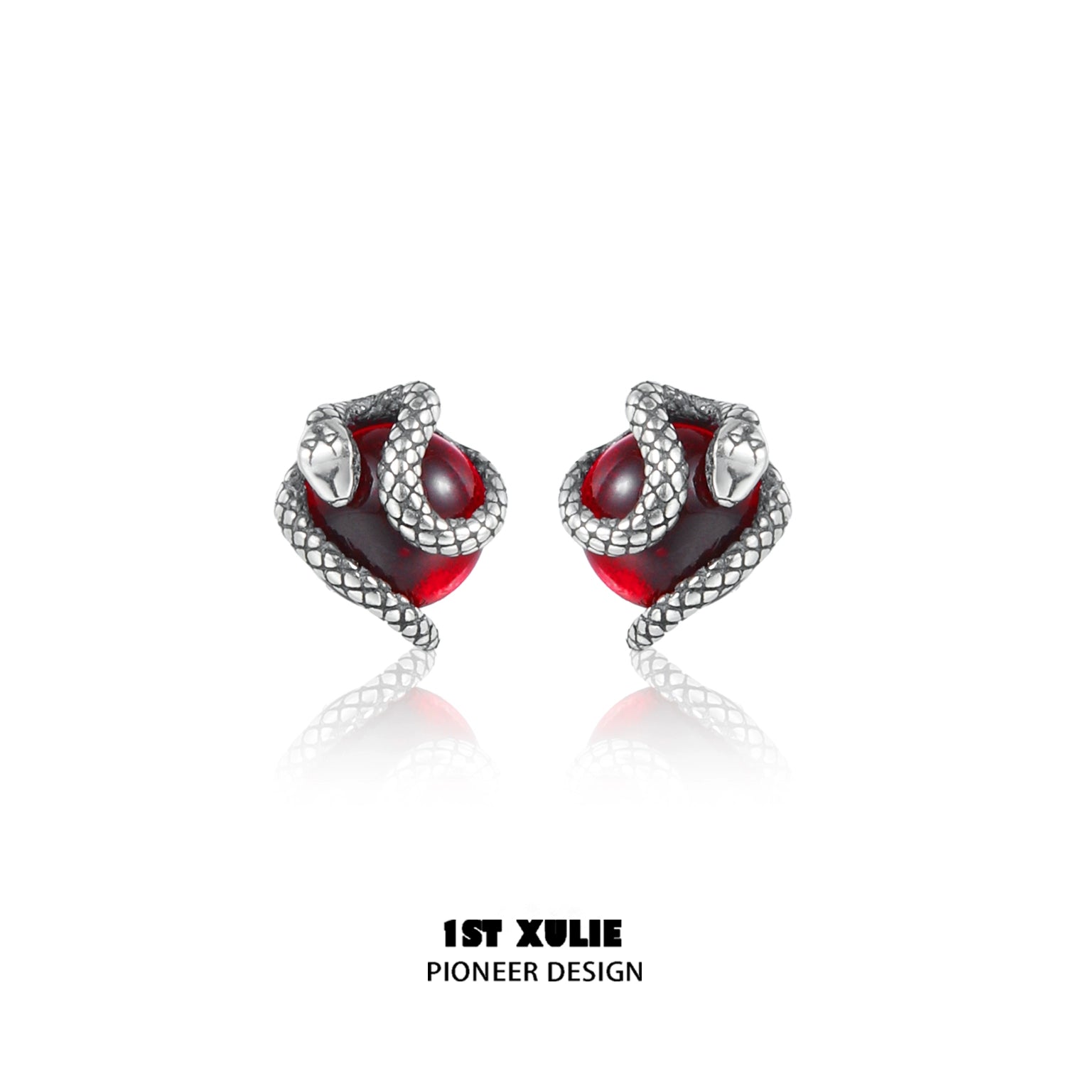 Y2K snake earrings with silver snake design wrapping around red gemstone for a stylish look