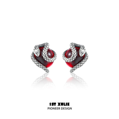 Y2K snake earrings with silver snake design wrapping around red gemstone for a stylish look