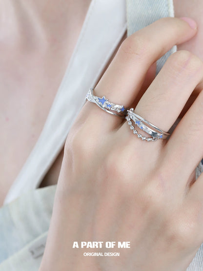 A PART OF ME planet chain ring showcased on a model's hand with stylish stars and elegant design