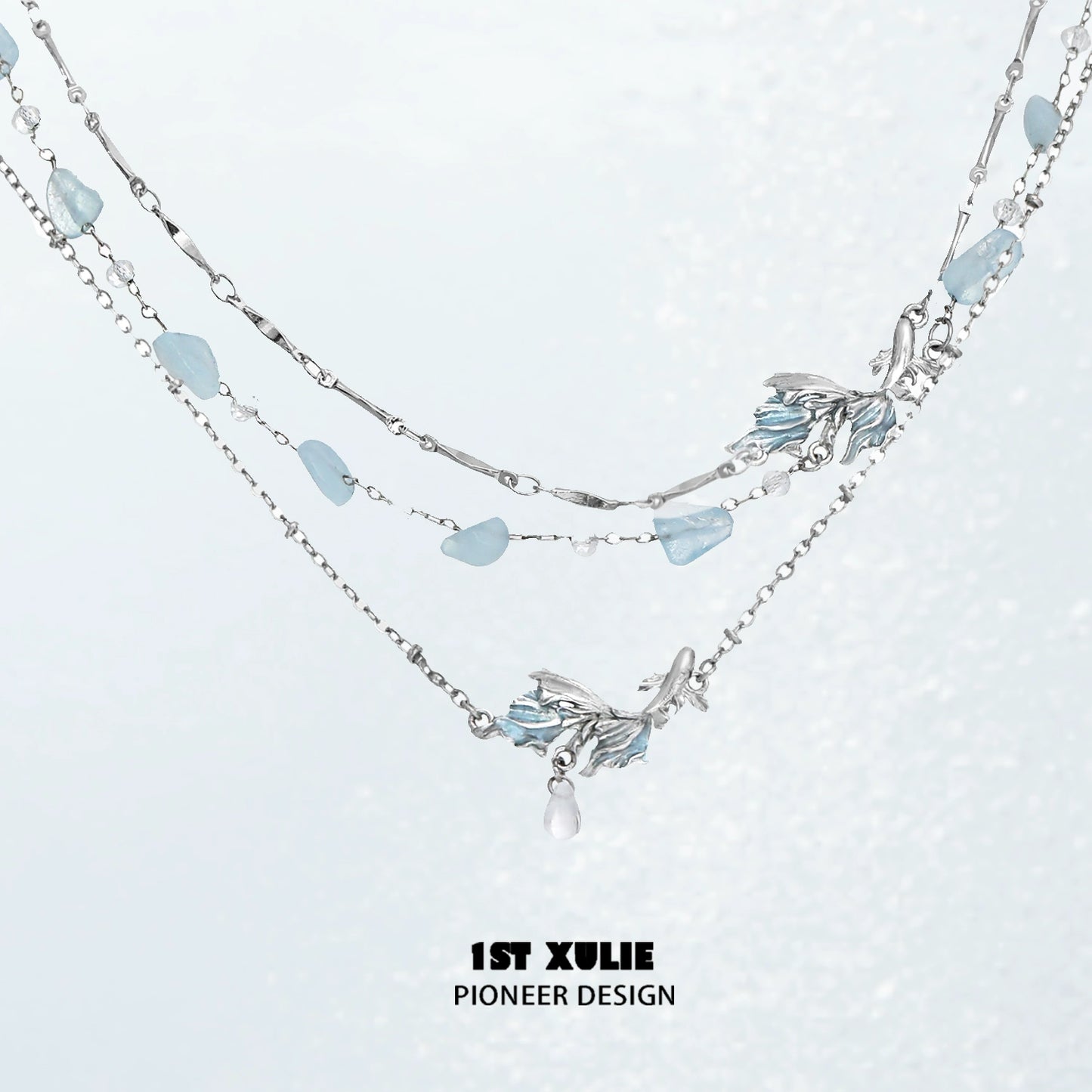 Playful fish necklace with silver chain and aqua-colored accents for a charming look