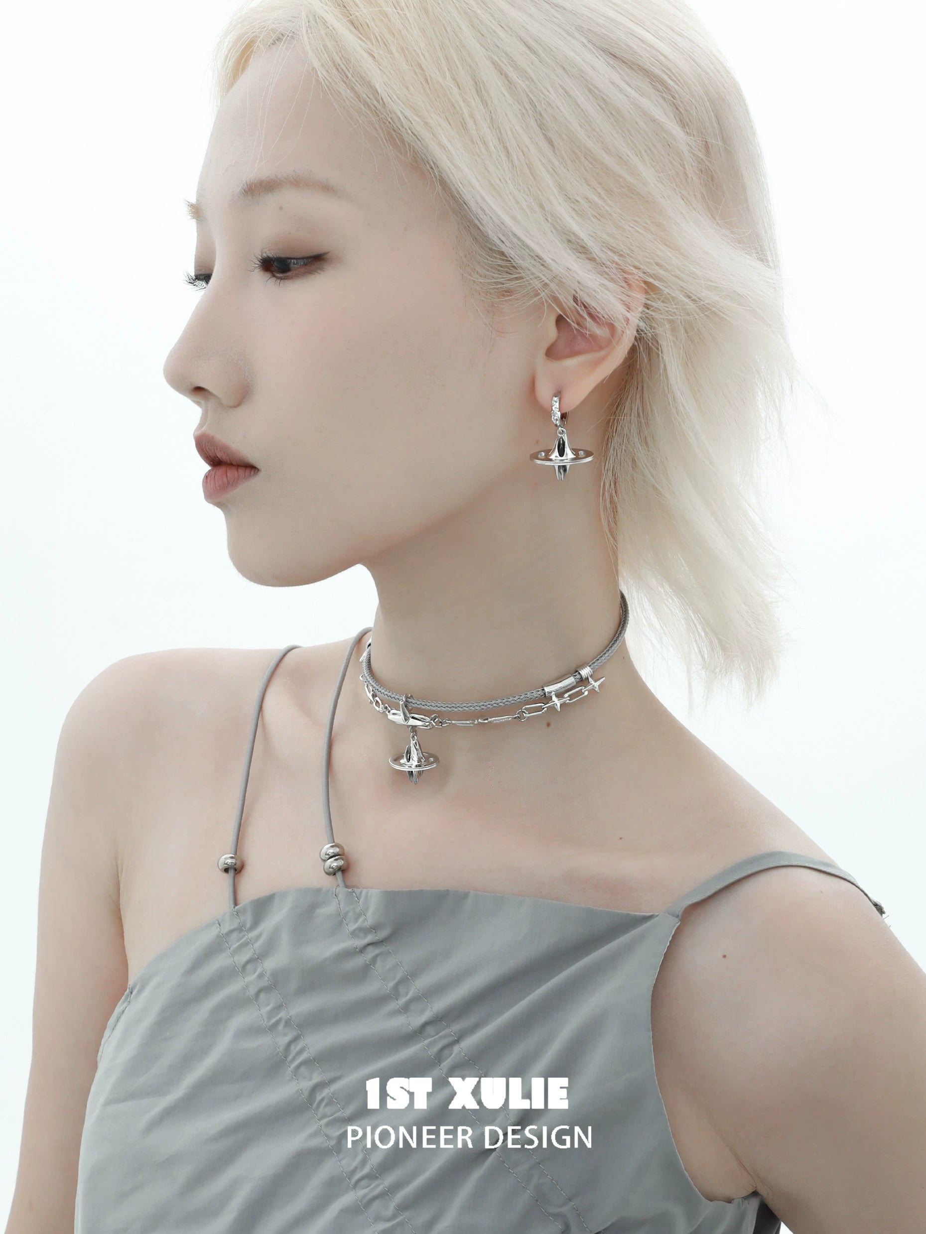 Model wearing a 1ST XULIE punk dreamcore necklace paired with matching earrings for a stylish look