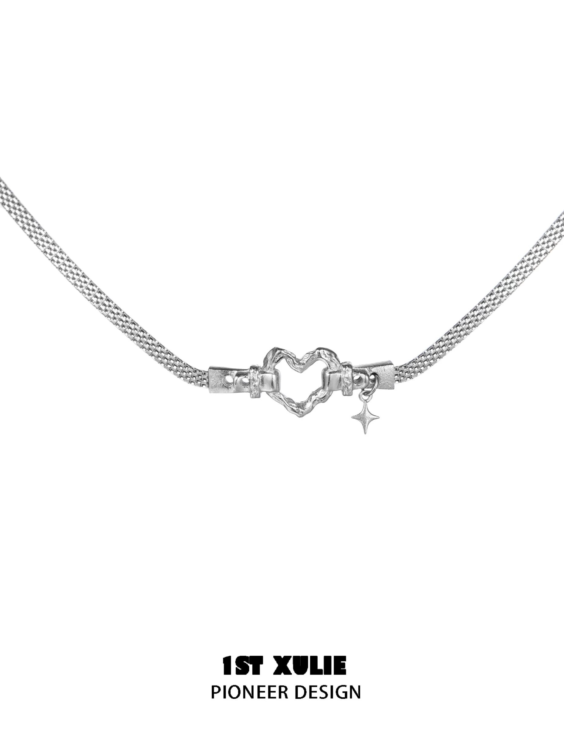 Silver punk heart necklace with a unique heart design and a star charm for stylish accessories