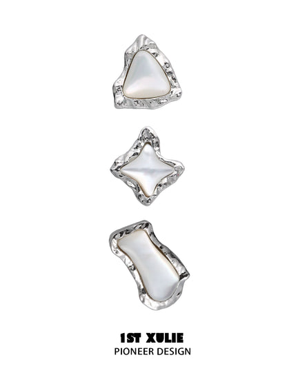 Punk moon fragment earrings in silver with unique organic shapes and glossy finish
