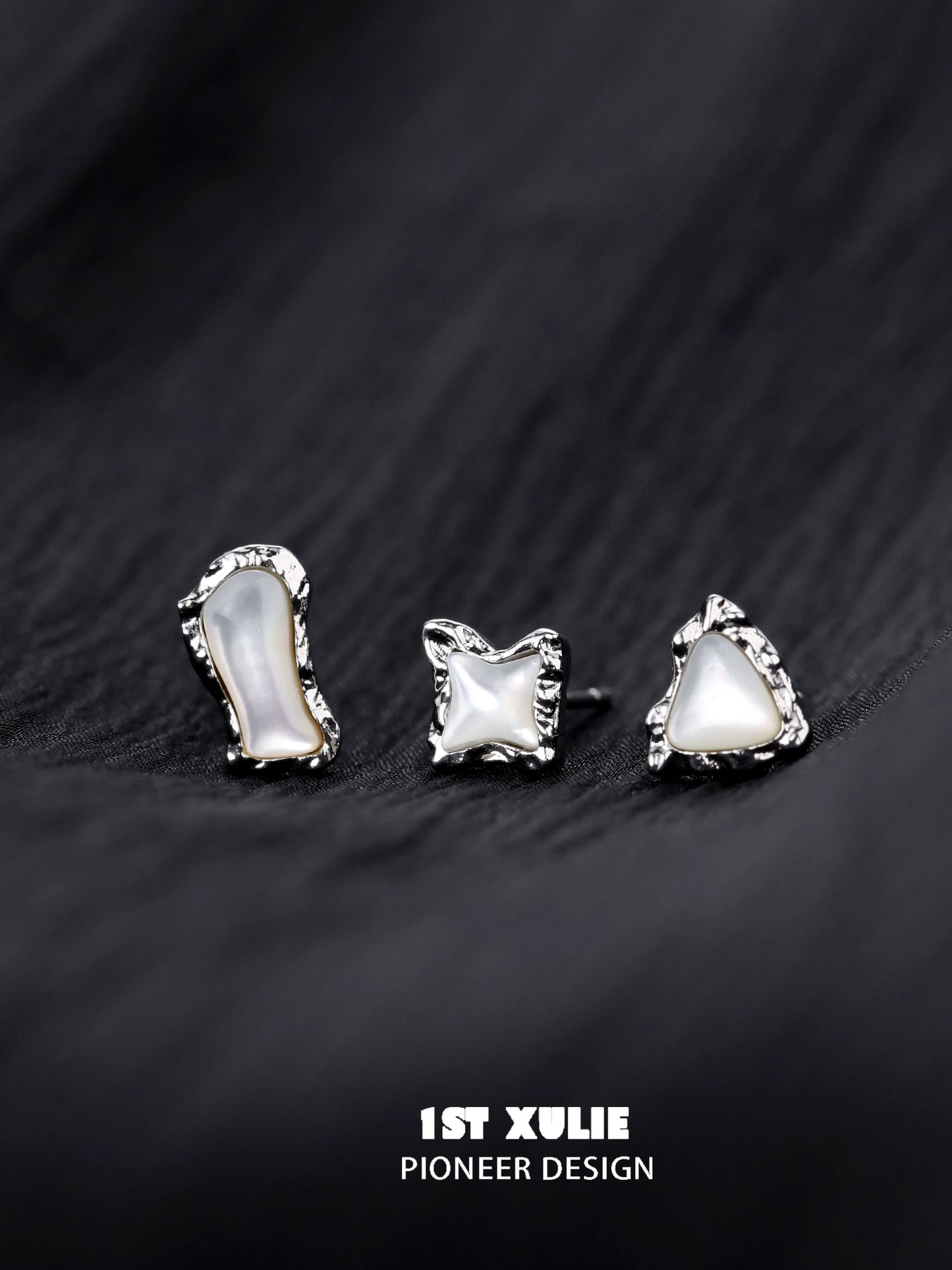Three unique punk moon fragment earrings with a silver finish and irregular shapes