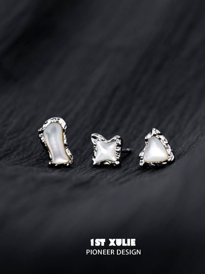 Three unique punk moon fragment earrings with a silver finish and irregular shapes