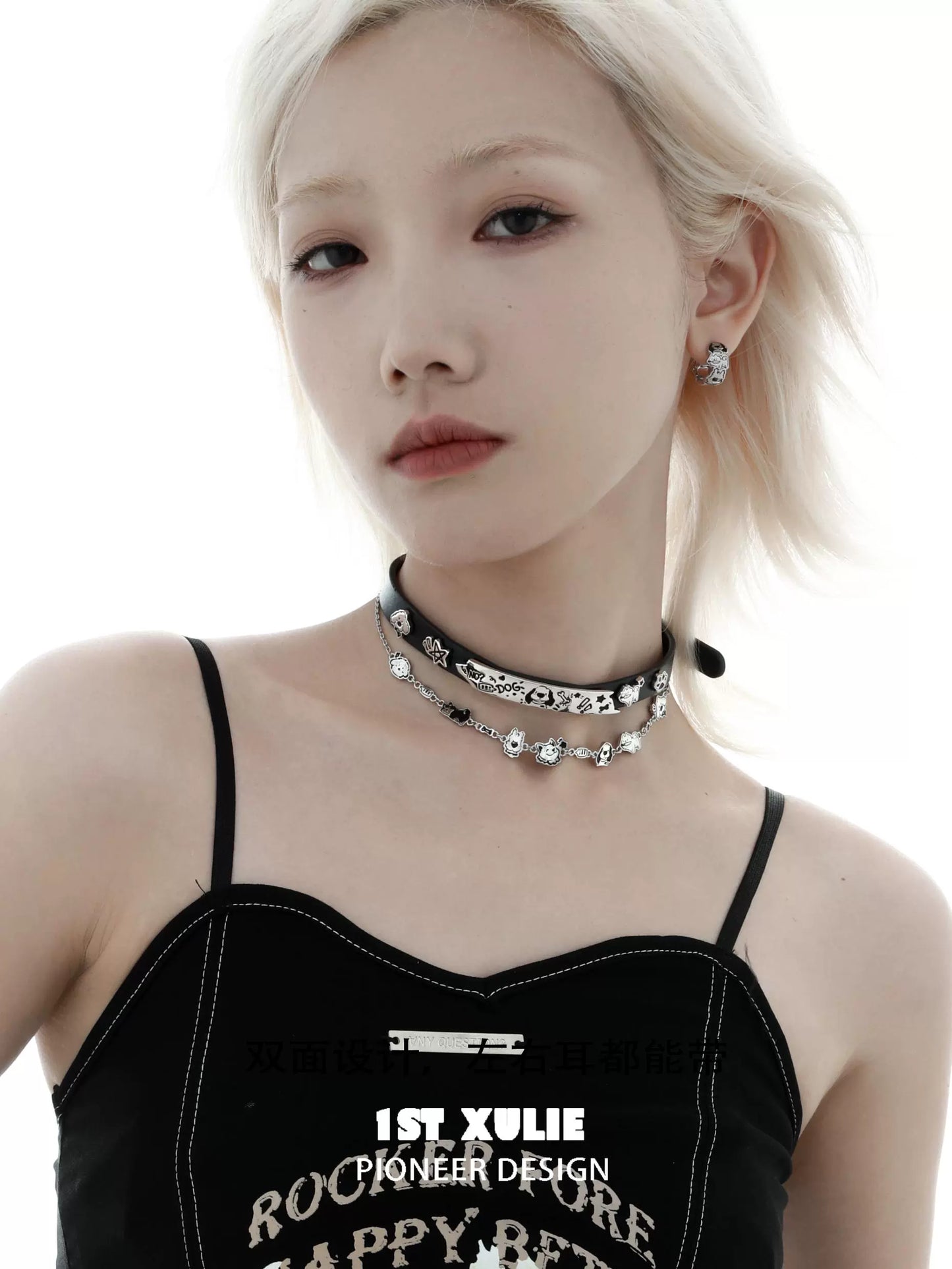 Punk puppy necklace displayed on a model with a stylish black outfit and silver accents