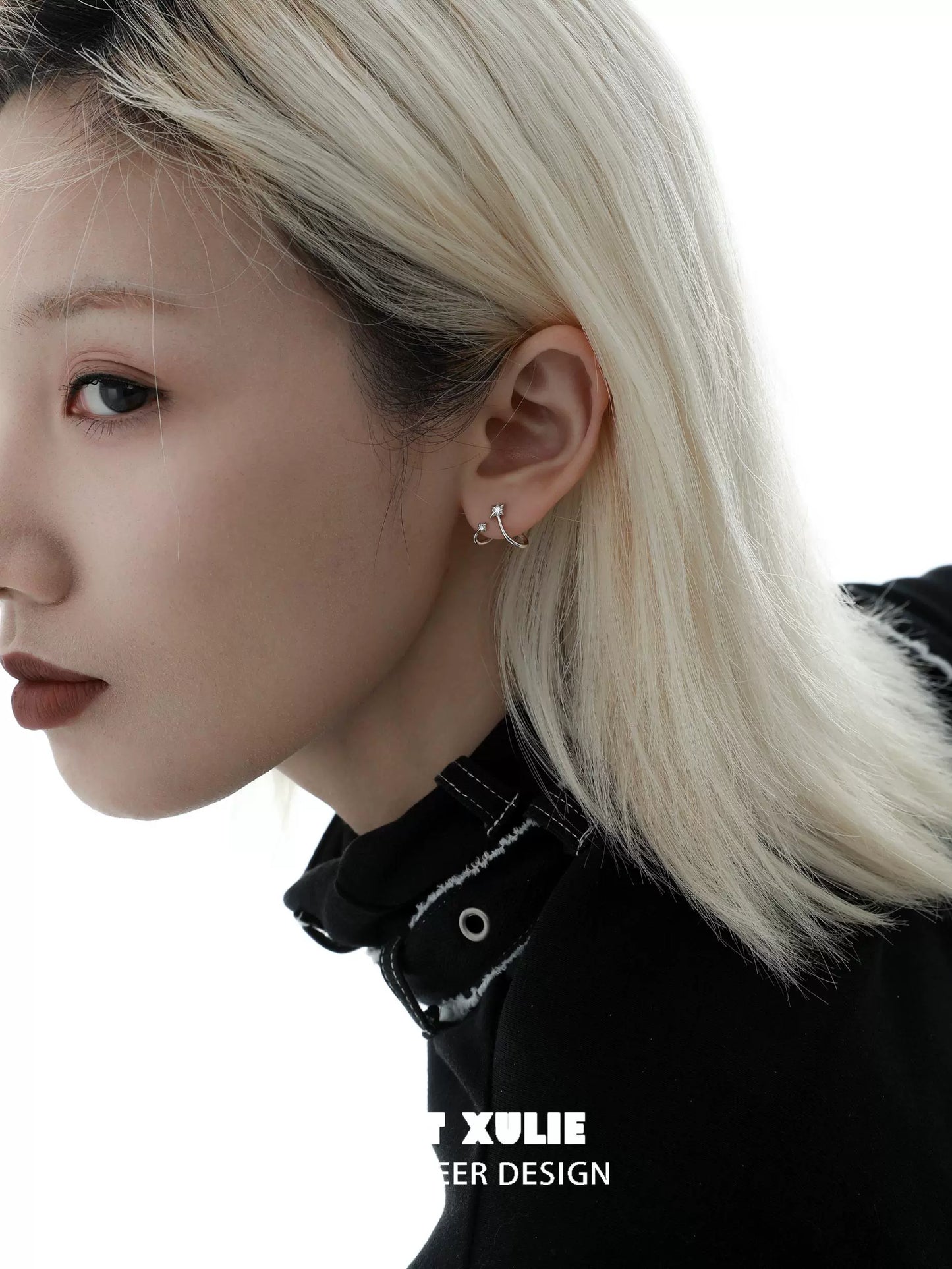 Stylish model wearing radiant zircon ear cuffs that enhance any elegant outfit