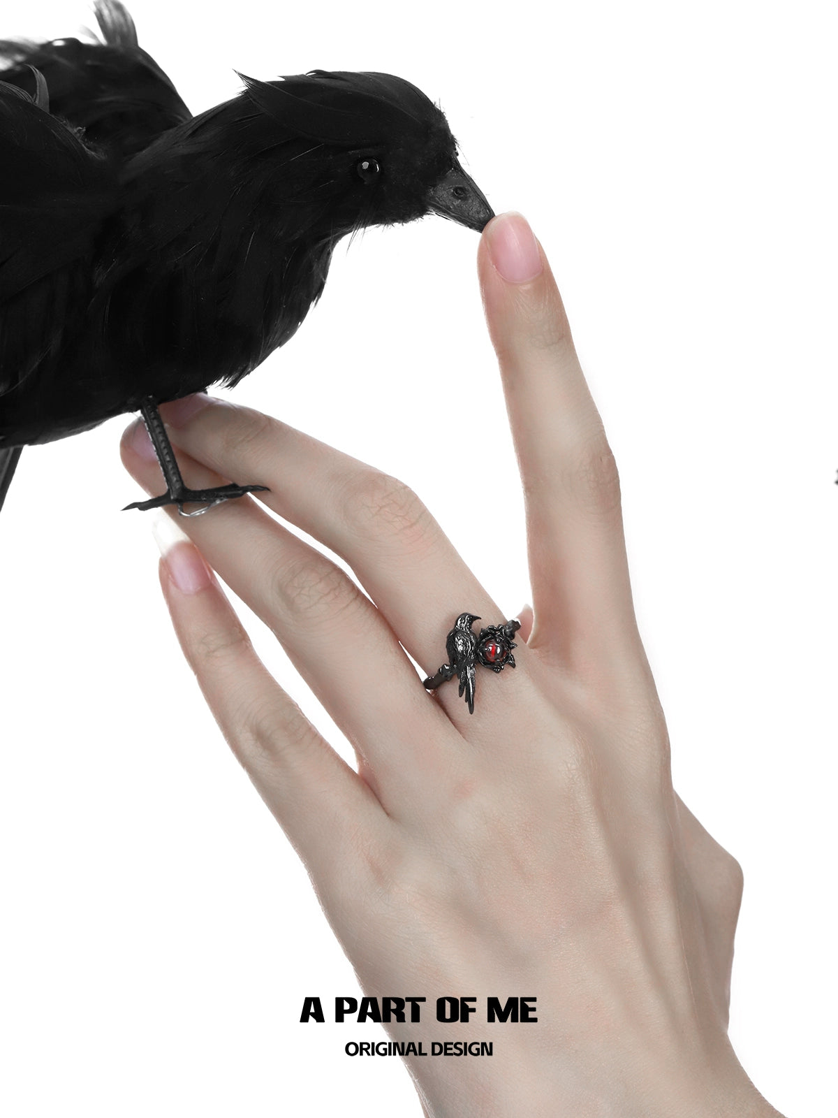 A PART OF ME raven heart ring featuring a unique design with a raven and gemstone accents