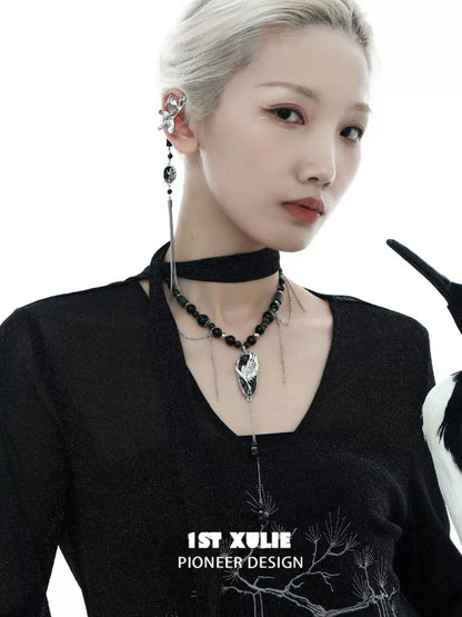 Rebellious crane tassel necklace featuring unique design with beads and elegant tassels