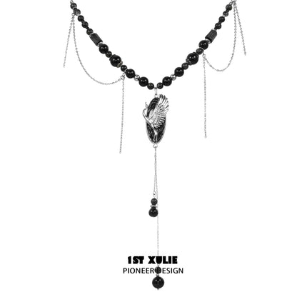 Rebellious crane tassel necklace with black beads and silver chains for a bold fashion statement