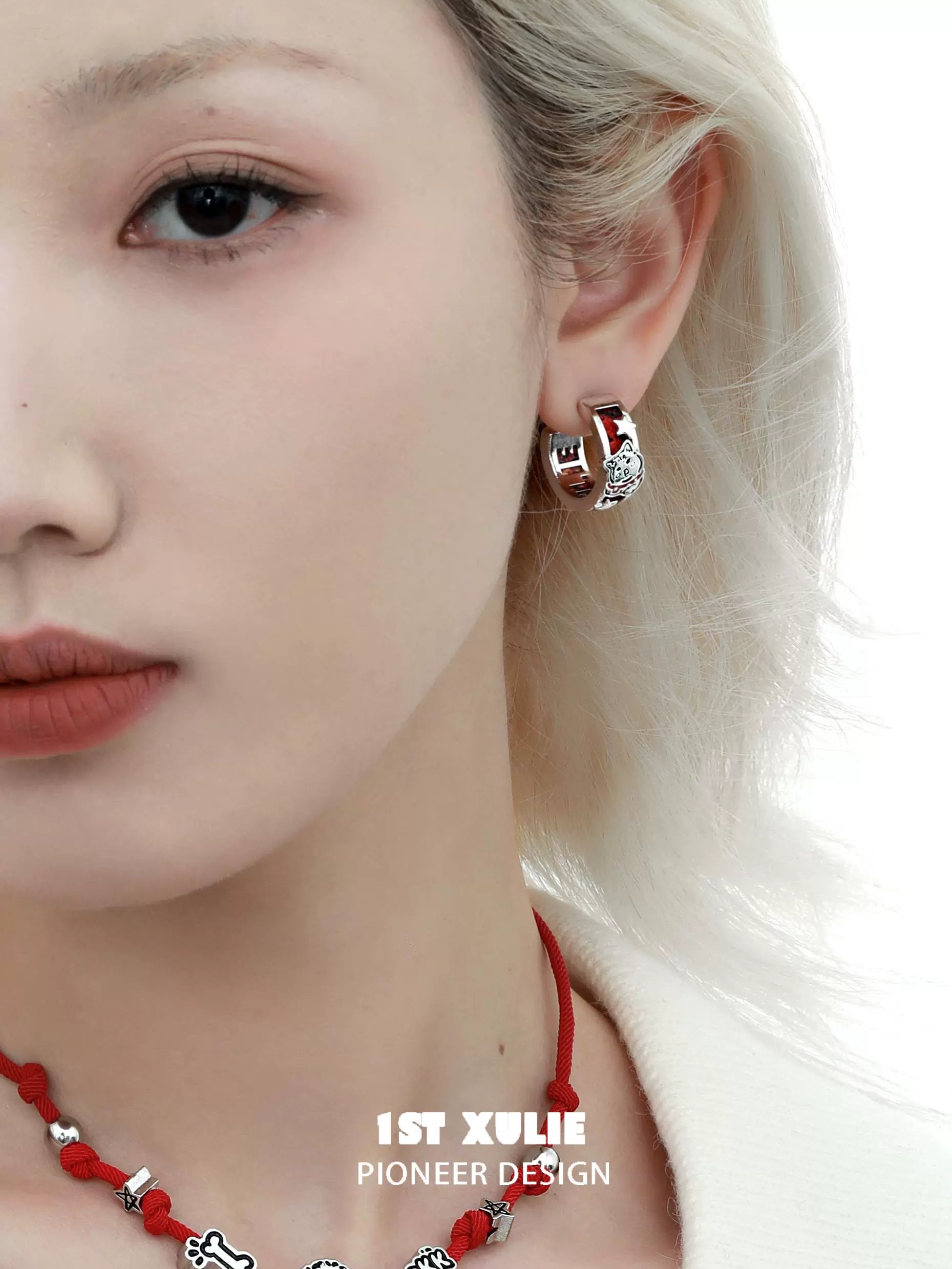 Stylish red puppy earrings featuring a cute design, perfect for animal lovers and fashion enthusiasts
