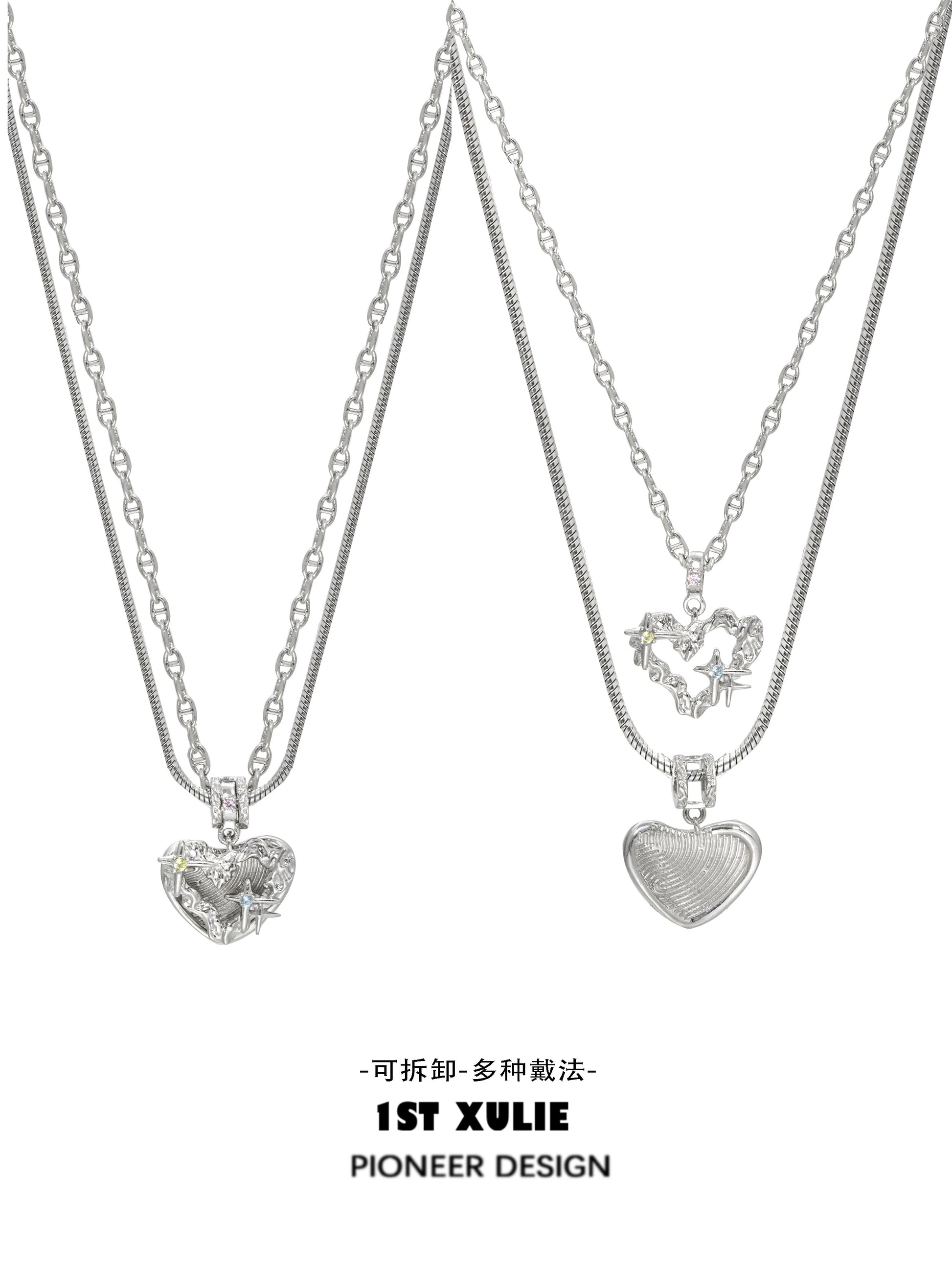 Silver removable clavicle chain necklace featuring two heart pendants, perfect for layering