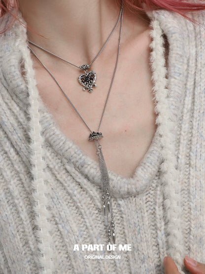 Stylish retro double-layer love necklace from A PART OF ME with heart pendant and tassel detail