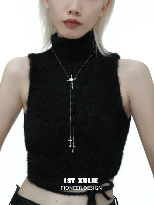 Stylish model wearing a rose cross necklace with a delicate silver chain for a trendy look