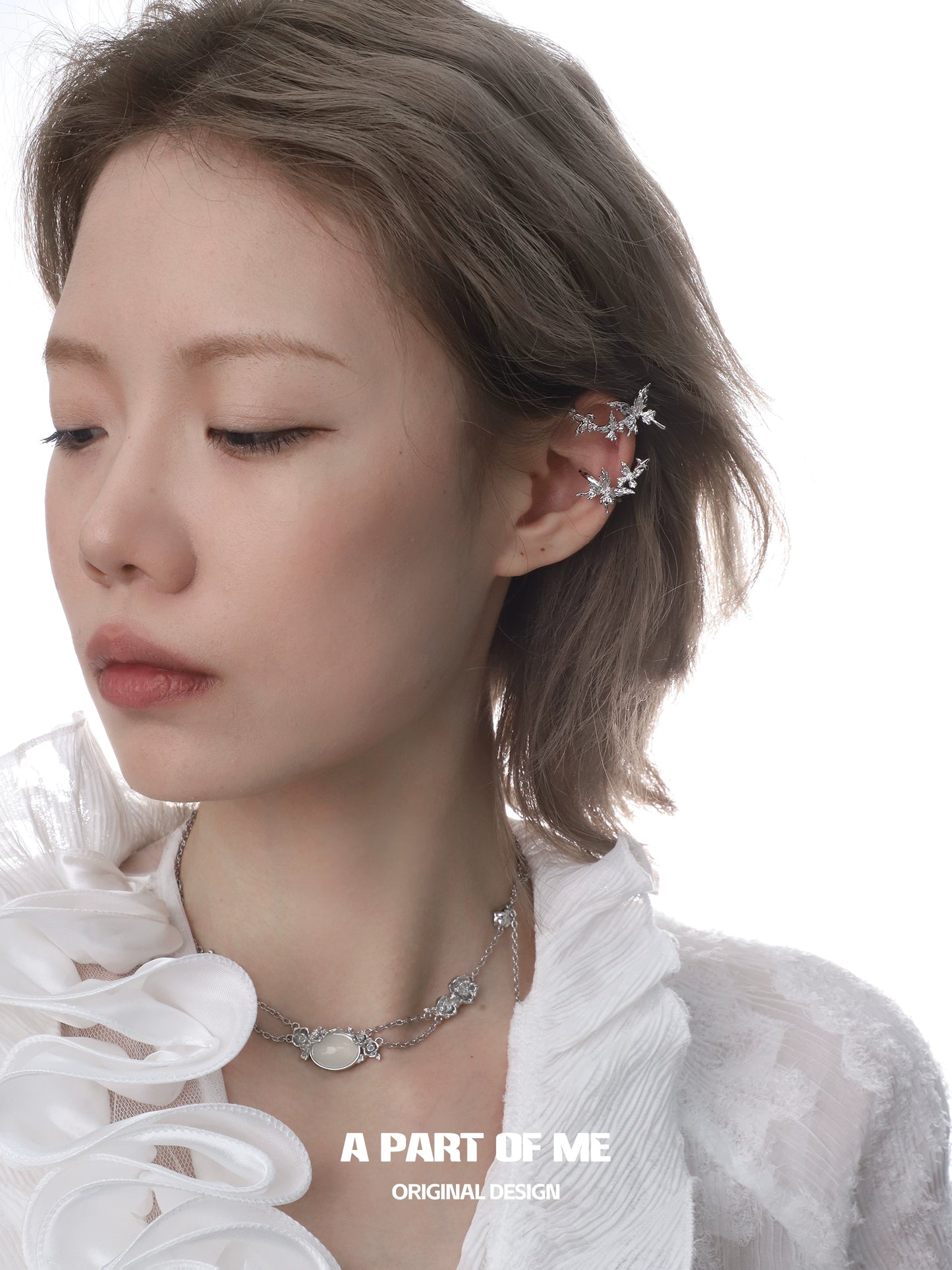 Elegant rose silver necklace with delicate floral designs worn by a model showcasing its beauty