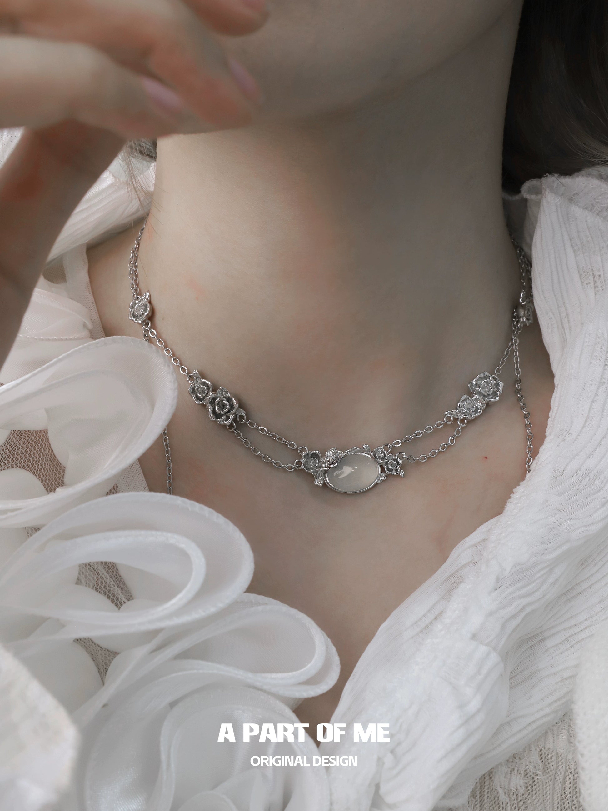 Rose silver necklace featuring elegant floral accents and a central pendant for a stunning look