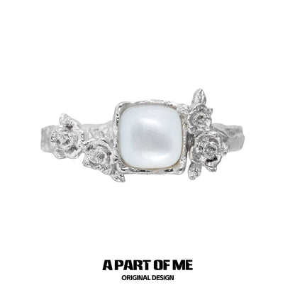 A Part of Me rose silver ring featuring a square pearl and detailed flower accents